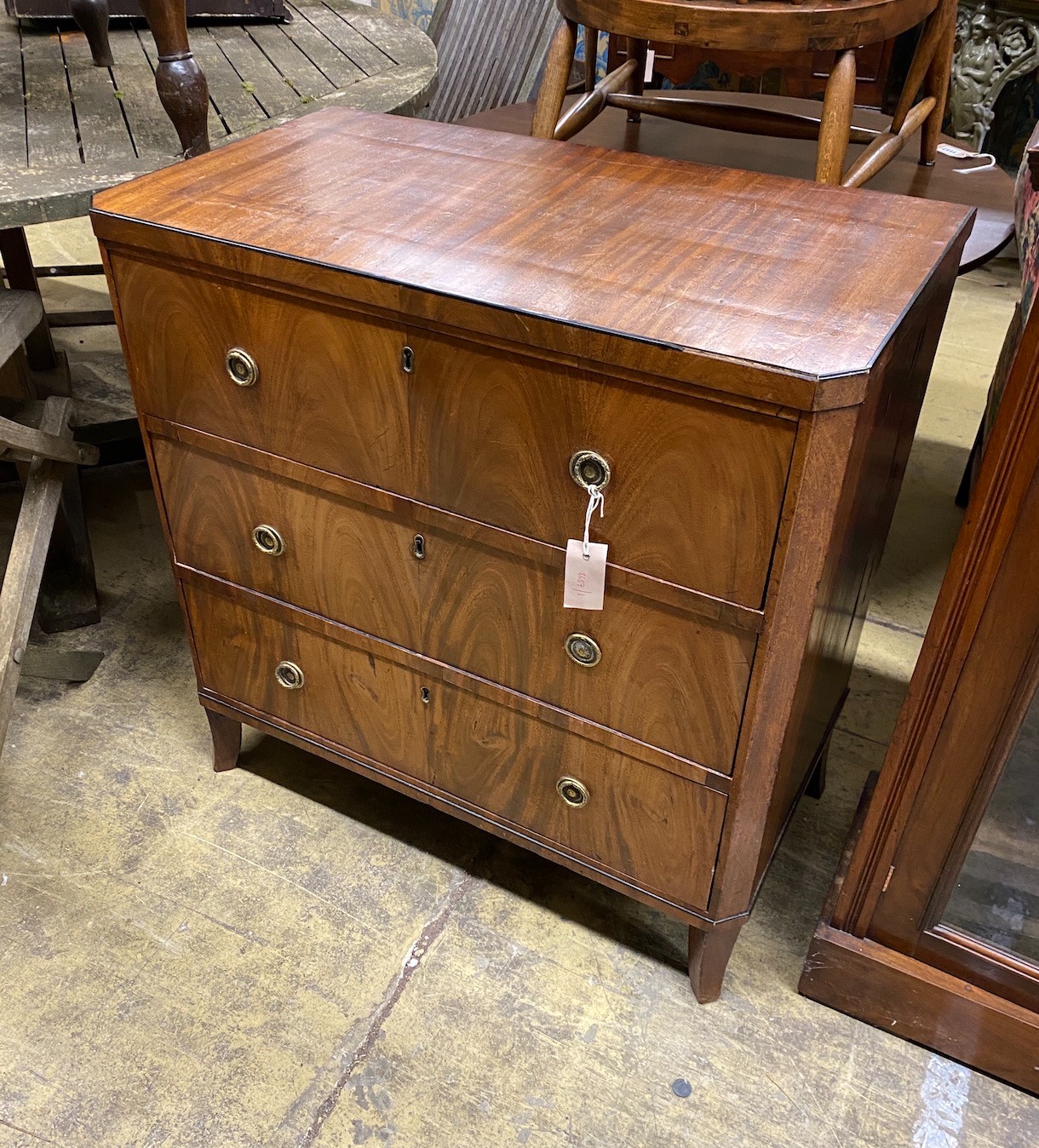 A small 19th century Continental mahogany three drawer chest, width 76cm, depth 43cm, height 78cm